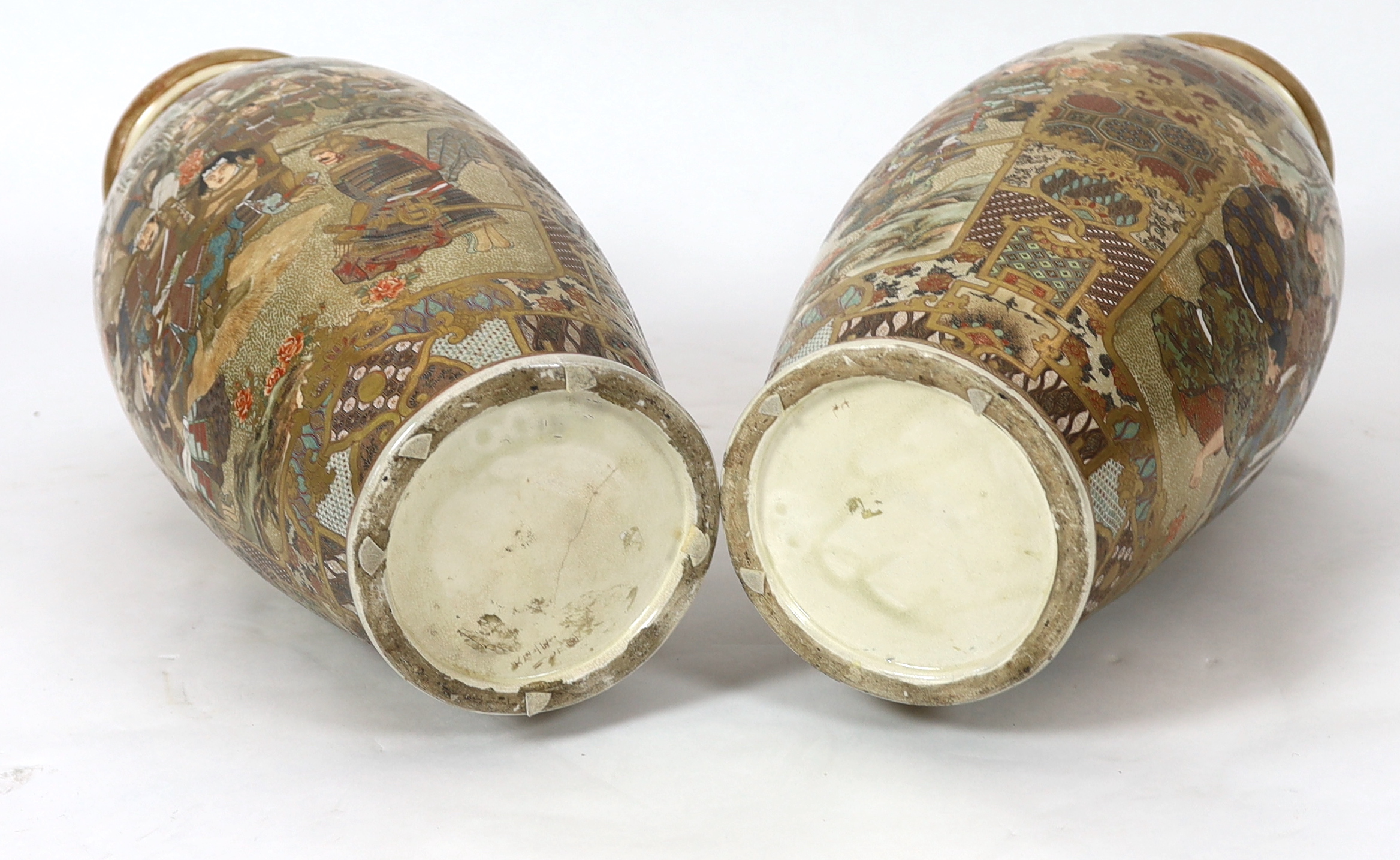 A pair of large Japanese Satsuma pottery 'Samurai' vases, Meiji period, one vase restored